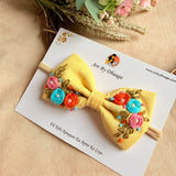 Little Daisy Hand Embroidered Toddler Bow Hair Tie – Yellow Floral Rubber Band
